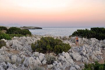 A glimpse of the indented shore along the eastern coast of Marina di Camerota at sunset. Salerno, Italy.