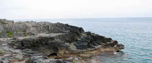 The typical limestone but rough and cavernous rock along Amalfi coast. Naples, Italy