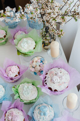 Beautiful Easter cakes on a decorated light table. A light holiday of Easter.
