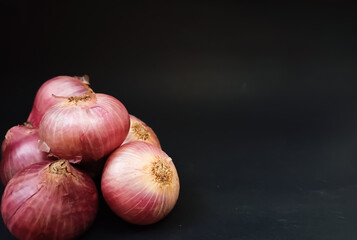 red onion on black background