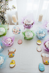 Beautiful Easter cakes on a decorated light table. A light holiday of Easter.