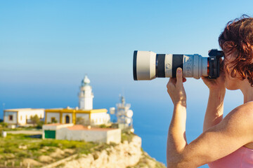 Fototapeta premium Tourist take photo at lighthouse, Cabo de Gata, Spain