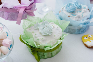 Beautiful Easter cakes on a decorated light table. A light holiday of Easter.