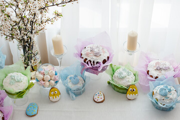 Beautiful Easter cakes on a decorated light table. A light holiday of Easter.