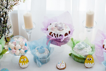 Beautiful Easter cakes on a decorated light table. A light holiday of Easter.