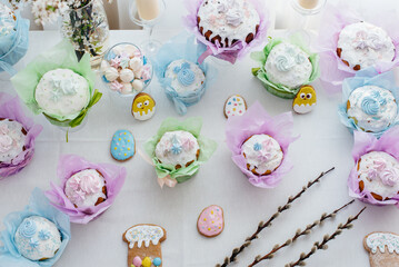Beautiful Easter cakes on a decorated light table. A light holiday of Easter.
