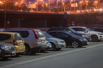 Cars in a parking lot at night in the city