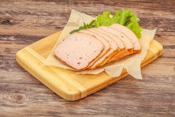 Boiled pork sausage over board