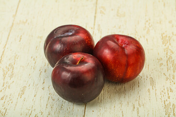 Ripe sweet plum fruit heap
