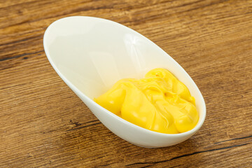 Natural cheese sauce in the bowl