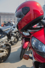 Fototapeta premium Motorcycle helmet on the handlebars of a motorcycle