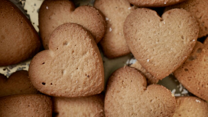 Fototapeta na wymiar Heart-shaped cookies for Valentine's Day. Background image with sweets.
