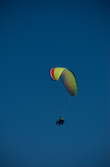 paragliding alone in blue sky without any clouds