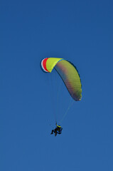 paragliding alone in blue sky without any clouds