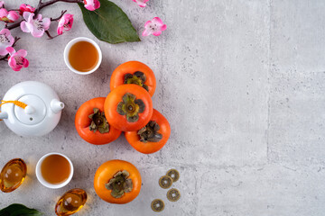 Top view of persimmons on gray table background for Chinese lunar new year