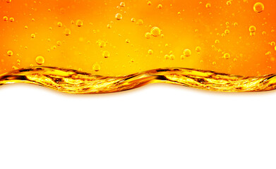 Fototapeta premium Liquid flows yellow, for the project, oil, honey, beer or other variants on white background, area for text. Oil background.