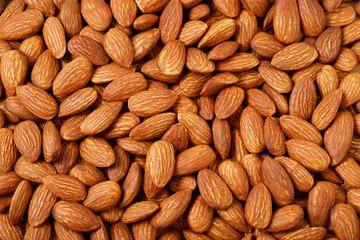 Pattern Organic almond nut raw peeled as background, top view. Healthy snack or for vegetarians. 