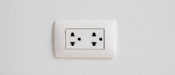 Electrical power socket plug outlet on concrete white wall. copy space banner.