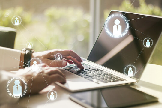 Social network concept with hands typing on laptop on background. Multiexposure