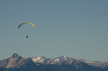 fly over the mountain range, paragliding in bariloche