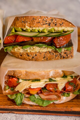 delicious sandwich on wooden table ready to eat