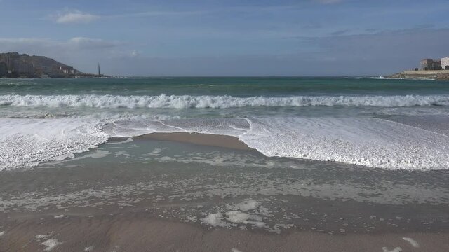 Beautiful frontal view towards the sea of the waves reaching the Riazor beach in La Coru&ntilde;a