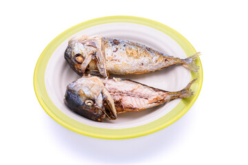 Delicious fried mackerel in a plate on a white background - top view
