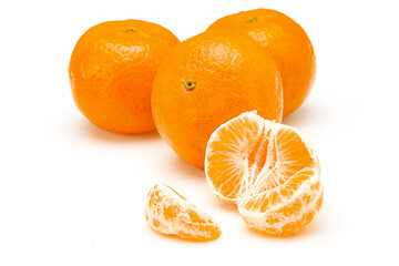 Whole mandarins and segments isolated on white background
