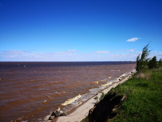 Southern shore of Lake Ilmen waves pebbles strong wind