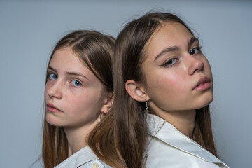 Portrait of two beautiful young girls, close up