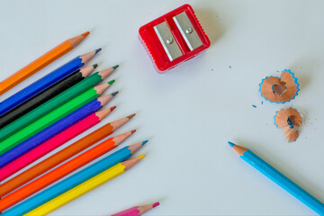Color pencils and a shaver for the background of paper to draw a color circle