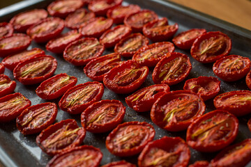 Juicy sun dried tomatoes on paper.