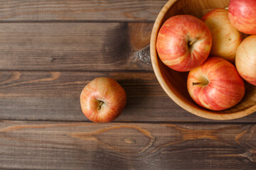 Red apples  wooden background
