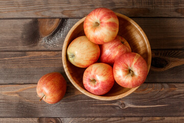 Red Apples on a old wooden background