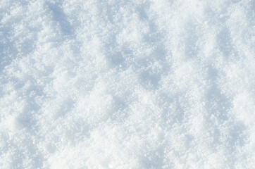 Background of fresh snow texture. Top view of the natural pure snow in winter with copy space. Beautiful abstract snowy white texture for design. Winter landscape. Christmas background. Stock photo