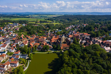 Fototapeta na wymiar Aerial view of the old town and castle Thurnau in Germany on a sunny day in spring. 