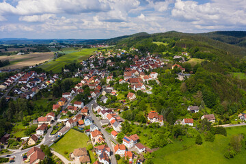 Fototapeta na wymiar Aerial view of the city and castle Theisenort close to Küps in Germany on a sunny day in spring. 