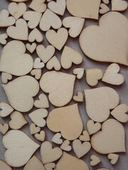 Fototapeta premium valentine's day greeting card-wooden hearts on a gray suede background. High quality photo