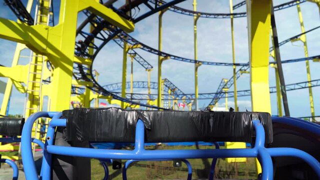 Cars And Train Of Closed Roller Coaster, In An Abandoned Funfair During Coronavirus Covid-19 Pandemic Lockdown, Empty Scenery In An Amusement Park