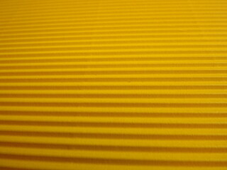Obraz premium yellow background with longitudinal stripes as an abstraction. High quality photo