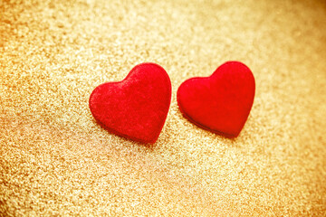 Heart symbol on a gold shiny background
