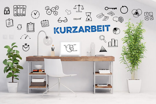 Kurzarbeit Konzept mit Schriftzug über Arbeitsplatz zuhause