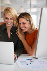 Happy lesbian couple planning, brainstorming at startup in office
