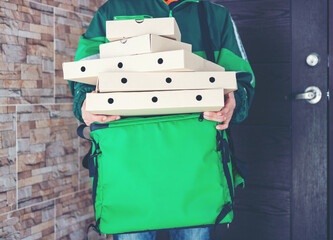 Smart delivery food service man handing pizza food to recipient customer at home , Woker service food shopping online.