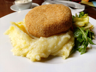 Fried breaded cheese and mashed potatoes gourmet lunch. 