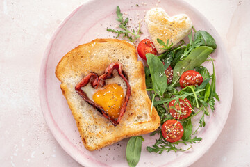 Egg in a hole of bread heart shape for Valentines day breakfast