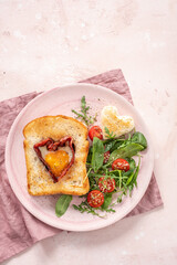 Egg in a hole of bread heart shape for Valentines day breakfast