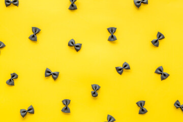 Pasta pattern - colored farfalle, top view. Italian food background