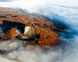 Amazing geological formatoion with fog. Basalt columns hill in upper Balaton region in Hungary. The...