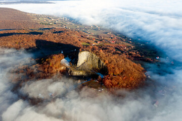 Amazing geological formatoion with fog. Basalt columns hill in upper Balaton region in Hungary. The...